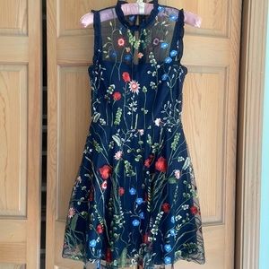 Navy City Studio with floral appliqué overlay